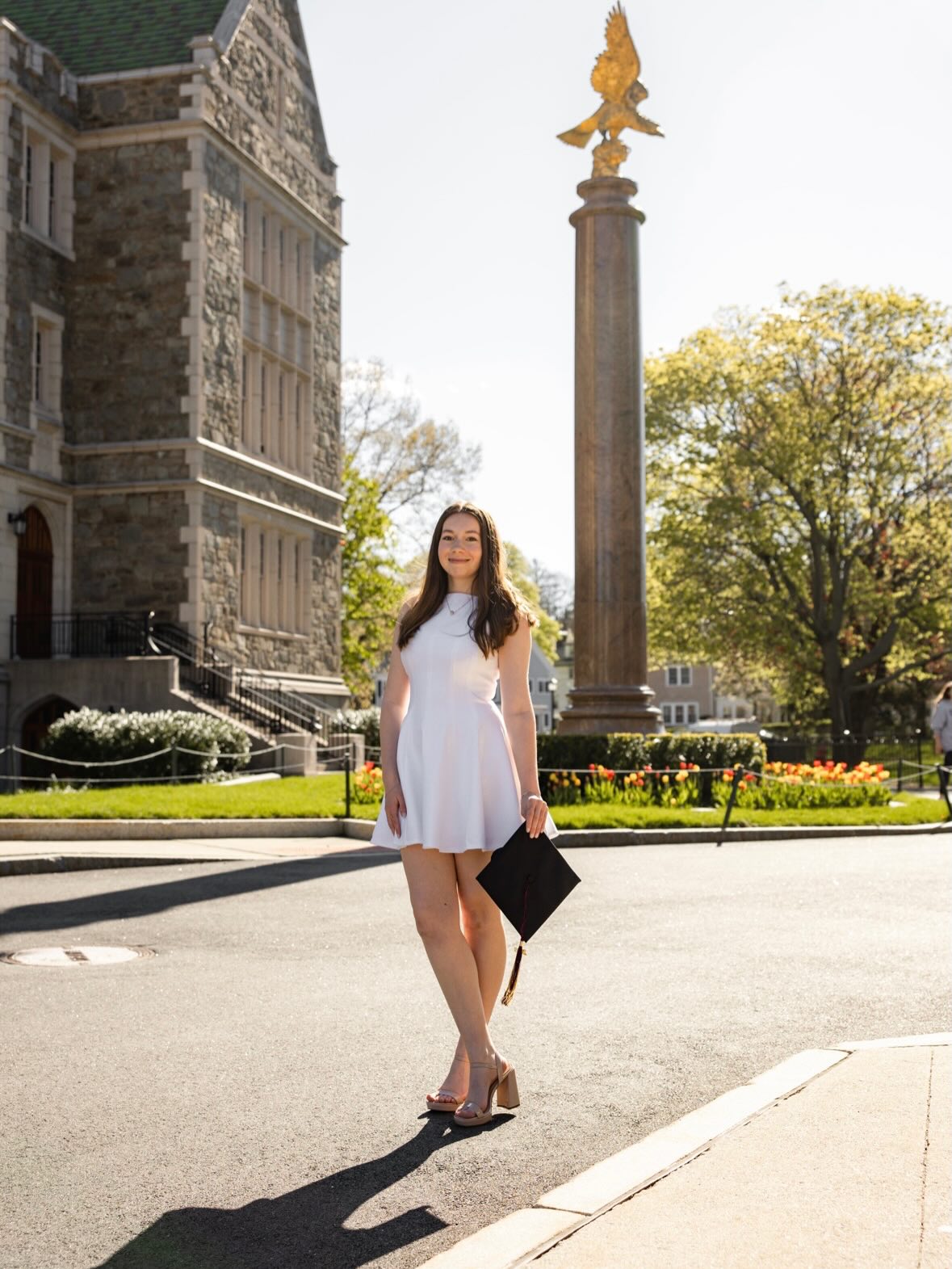 Graduate celebrating in cap and gown