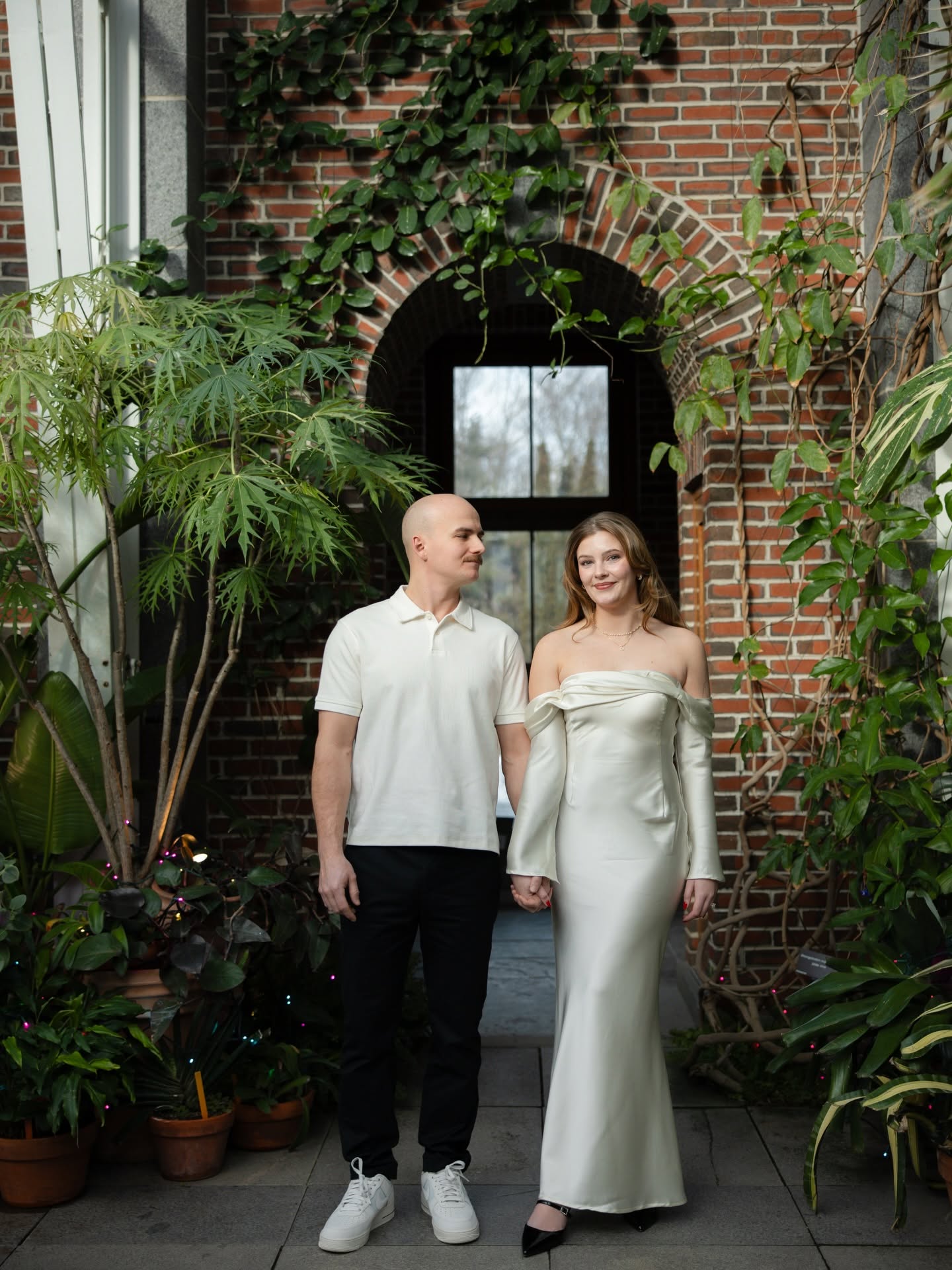 Bride laughing candidly on her wedding day, golden-hour light